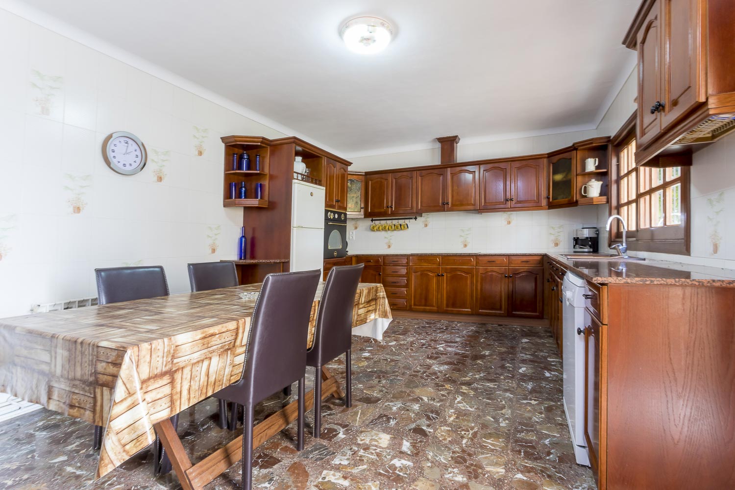 Big wood kitchen with dining-table in a rental house of Ibiza